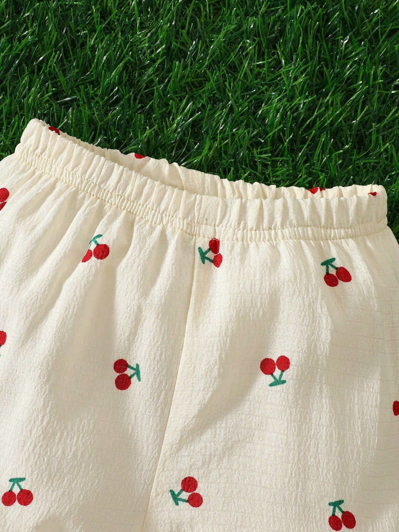 Prenda albaricoque short para bebe detalle de cintura elástica