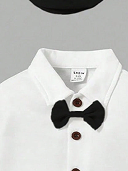 Prenda blanco negro conjunto para bebe detalle de moño y botones
