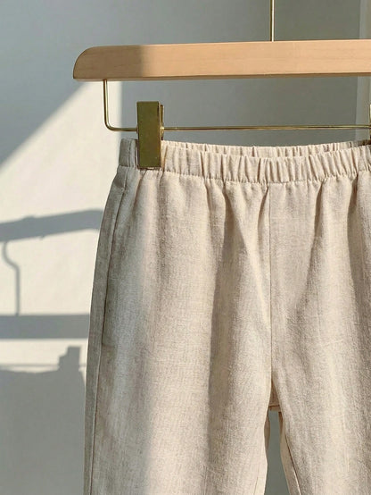 Conjunto beige claro para bebé con detalle de pantalón largo, cintura elástica y acabado texturizado