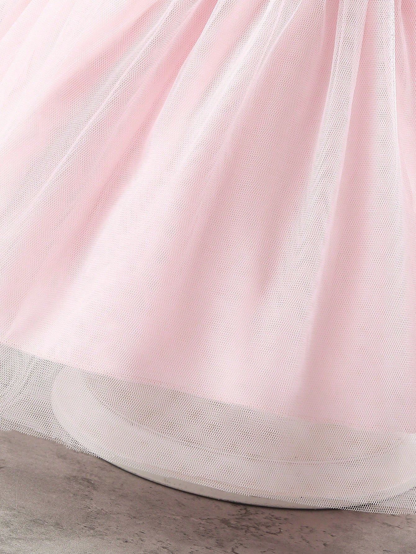 Prenda rosa vestido para bebe detalle de la falda de tul en capas