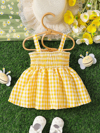 Prenda amarilla vestido para bebe a cuadros vista trasera