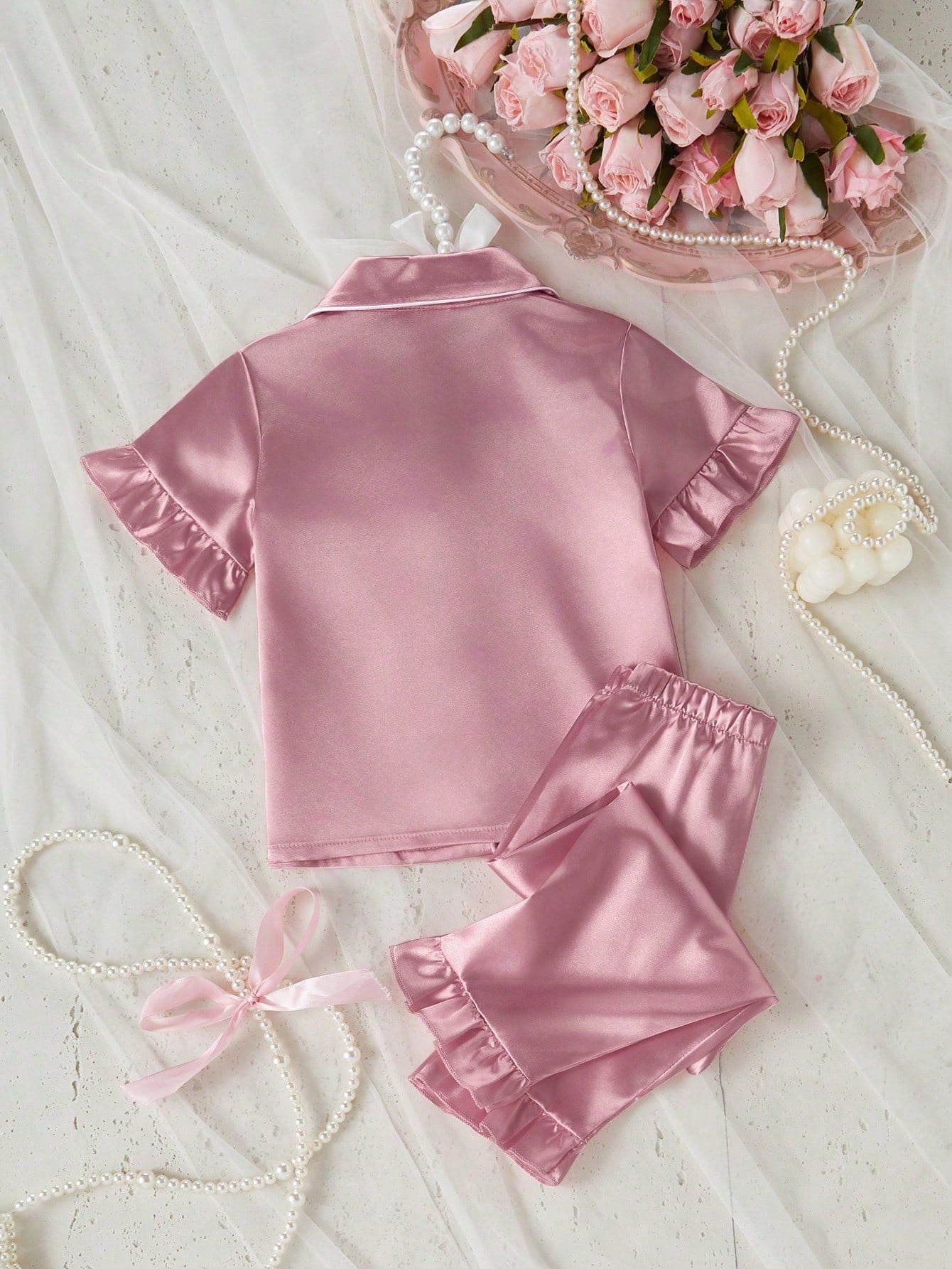 Prenda rosa pijama de satén para bebe vista posterior