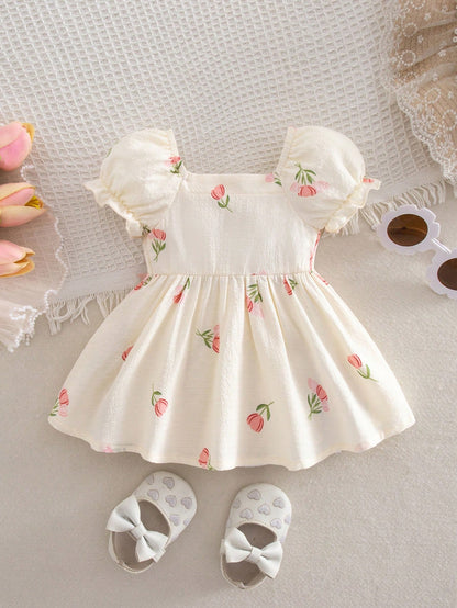 Prenda crema vestido para bebe con estampado floral vista posterior