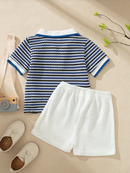 Prenda azul y blanca conjunto para bebe con polo a rayas vista trasera