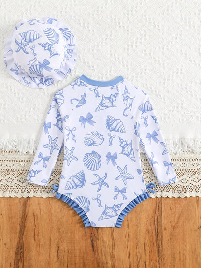 Prenda azul traje de baño para bebe con conchas marinas vista trasera