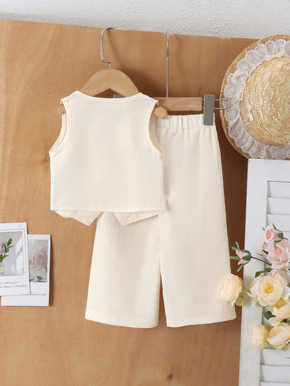 Prenda marfil conjunto para bebe con chaleco y pantalón vista trasera