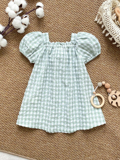 Prenda verde vestido para bebe a cuadros vista posterior