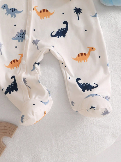 Prenda crema pelele para bebe con detalle de pies cubiertos y estampado de dinosaurios