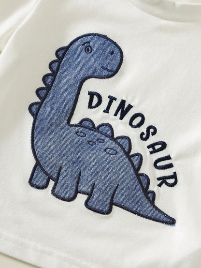 Prenda blanca camiseta para bebe con detalle de dinosaurio azul bordado