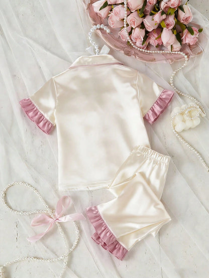 Prenda champán pijama para bebe con pantalón largo y detalle rosado vista posterior