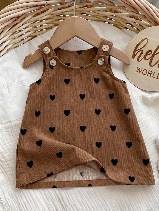 Prenda café vestido para bebe con corazones negros vista frontal