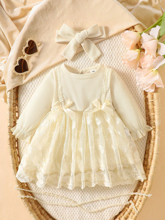 Prenda albaricoque vestido para bebe con encaje y diadema vista frontal