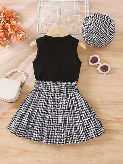 Prenda negro conjunto para bebe con falda blanco y negro diseño elegante vista completa
