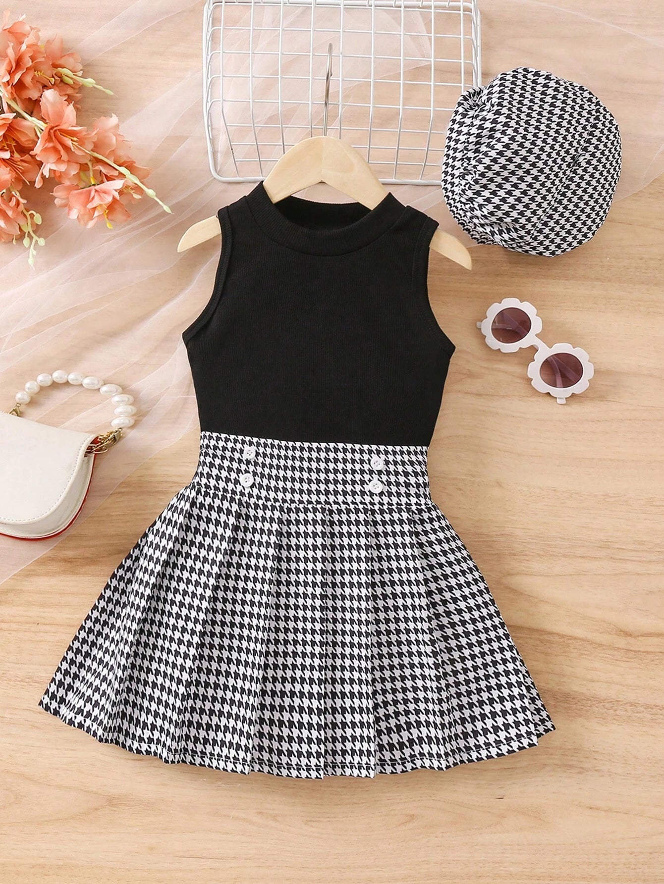 Prenda negro conjunto para bebe con falda estampado clásico vista frontal
