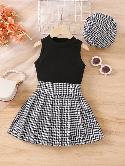 Prenda negro conjunto para bebe con falda estampado clásico vista frontal
