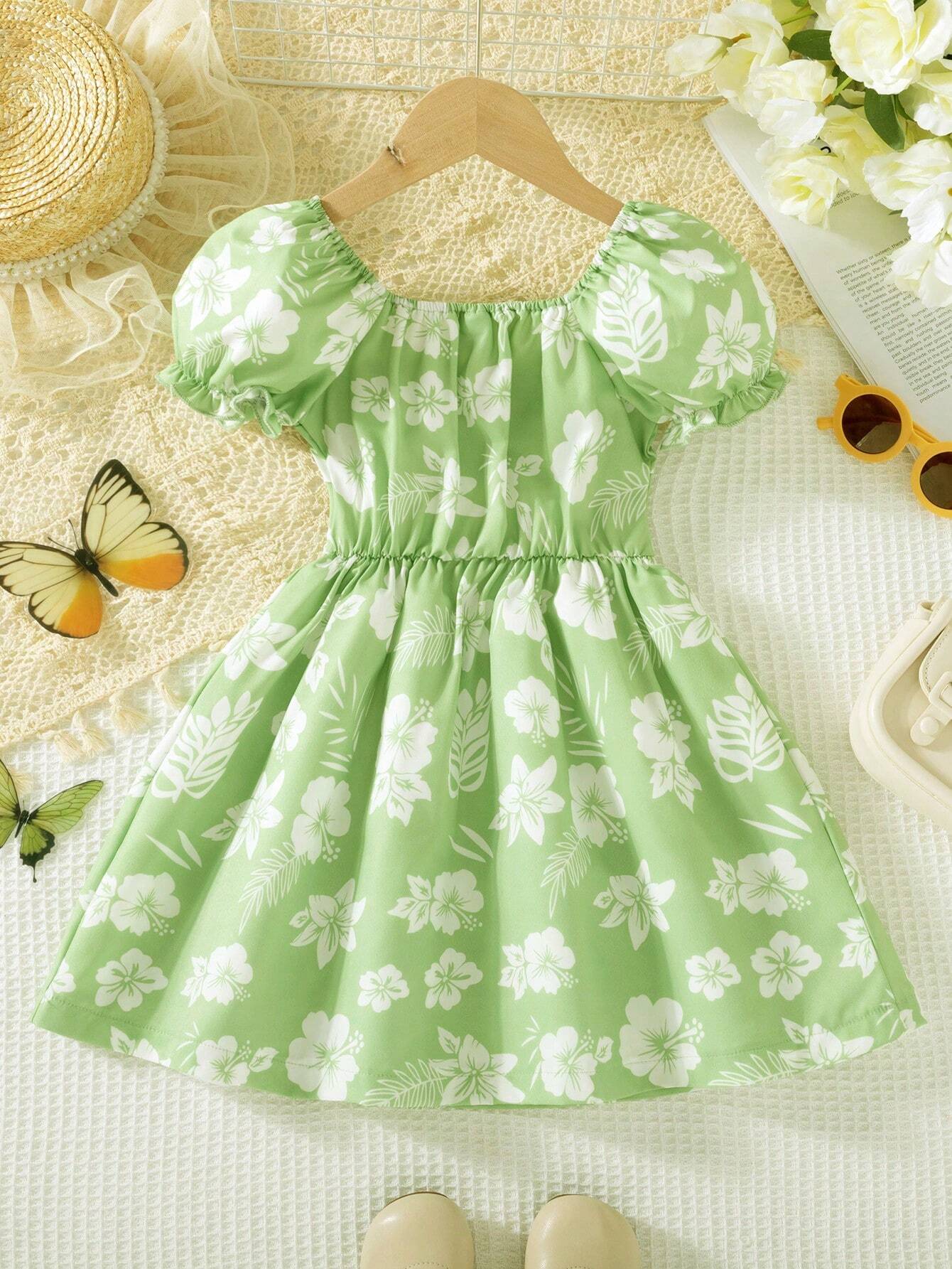 Prenda verde menta vestido para bebe vista trasera con mangas abullonadas
