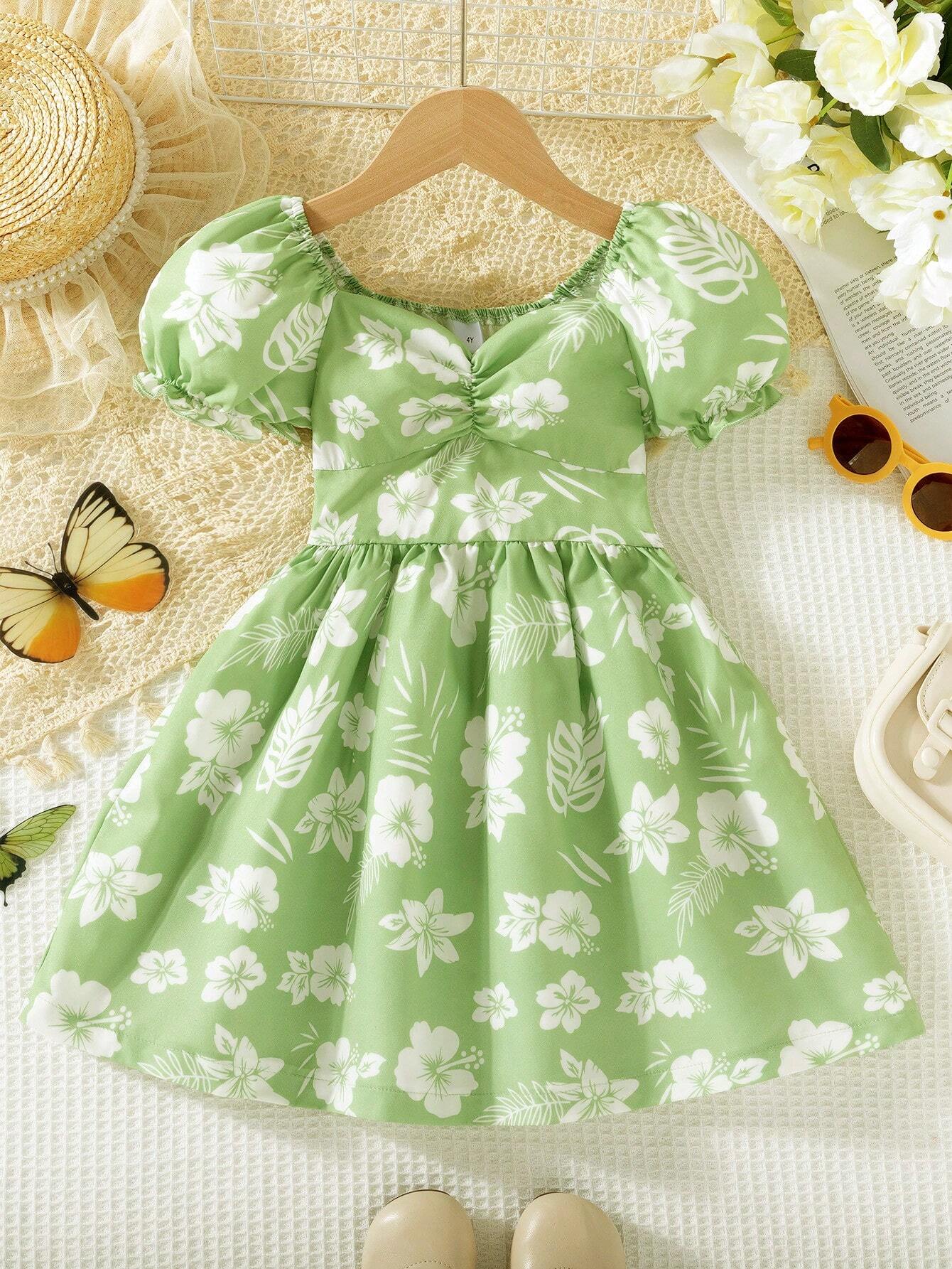 Prenda verde menta vestido para bebe con estampado floral vista frontal
