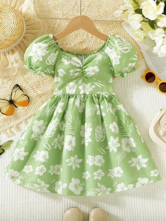 Prenda verde menta vestido para bebe con estampado floral vista frontal
