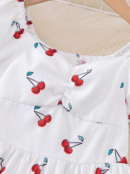 Prenda blanca vestido para bebe detalle de escote corazón con cerezas
