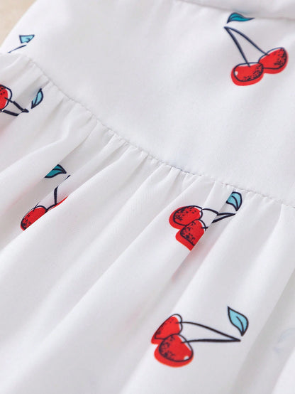 Prenda blanca vestido para bebe detalle de falda estampada de cerezas