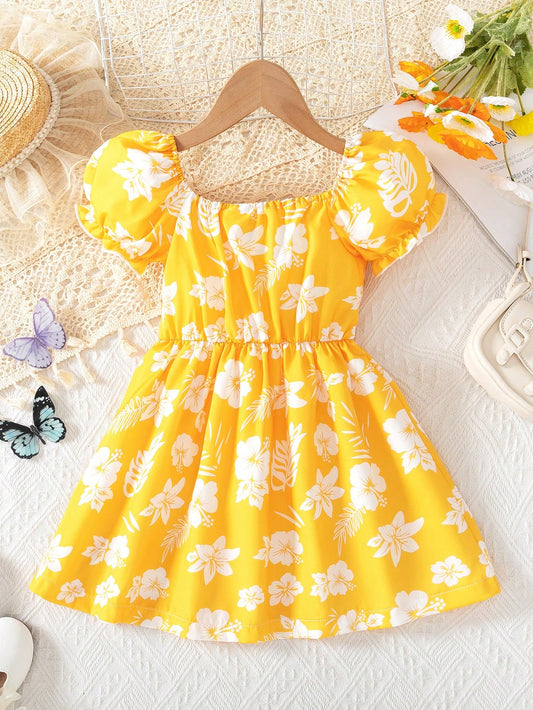 Prenda amarilla vestido floral para bebe vista posterior