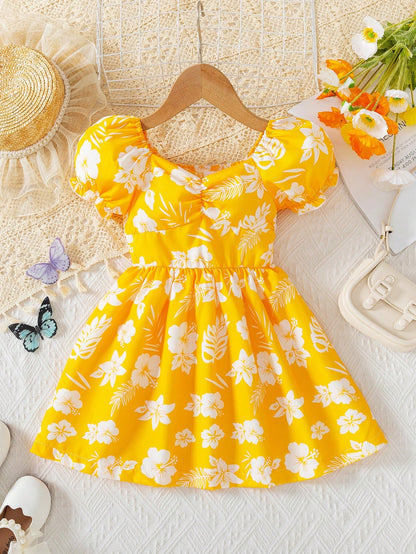Prenda amarilla vestido floral para bebe vista frontal