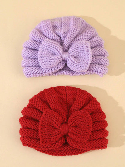 Prenda multicolor diadema tejida para bebe con lazo vista frontal
