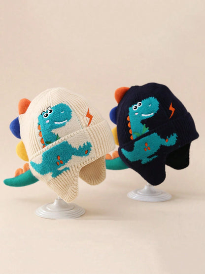 Prenda beige gorro para bebe con dinosaurio tejido vista frontal