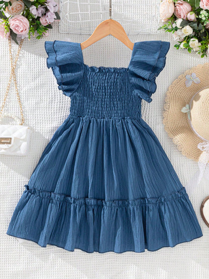 Prenda azul vestido para bebe con falda amplia y detalle de volantes