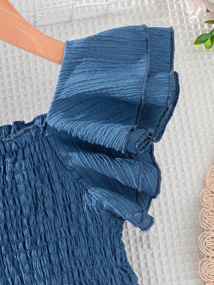Prenda azul vestido para bebe con detalle de manga con volantes