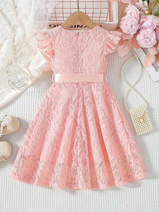 Prenda rosa vestido de encaje para bebe vista trasera con detalle de cinturón