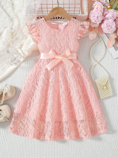 Prenda rosa vestido de encaje para bebe vista frontal con lazo decorativo