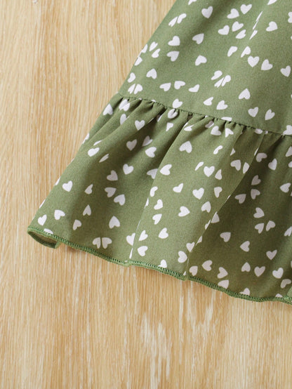 Prenda verde vestido para bebe detalle de volante en el bajo
