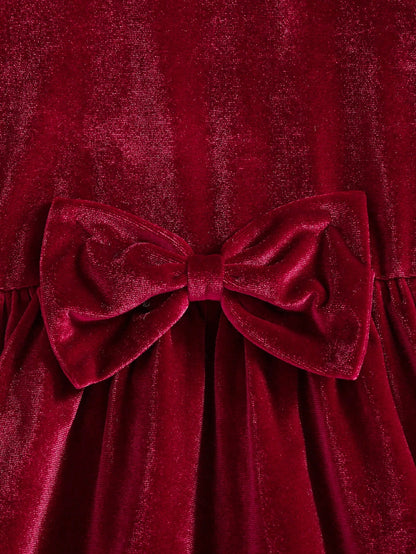 Prenda roja vestido de terciopelo para bebe detalle de lazo frontal