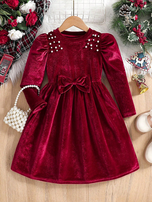Prenda roja vestido de terciopelo para bebe vista frontal con lazo y perlas