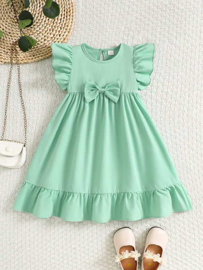 Prenda verde menta vestido para bebe con lazo y volantes vista frontal