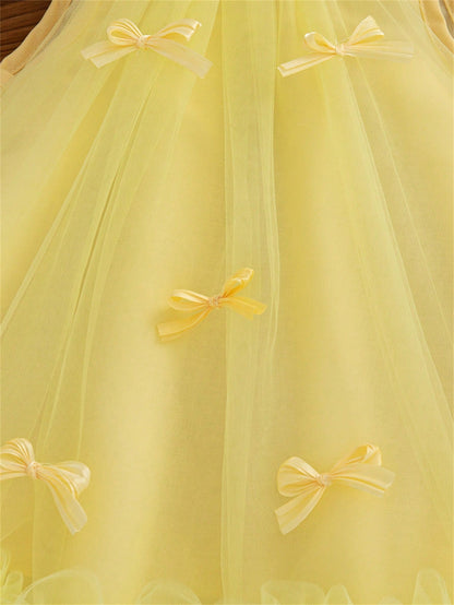 Prenda amarilla vestido de tul para bebe detalle de tul y lazos decorativos