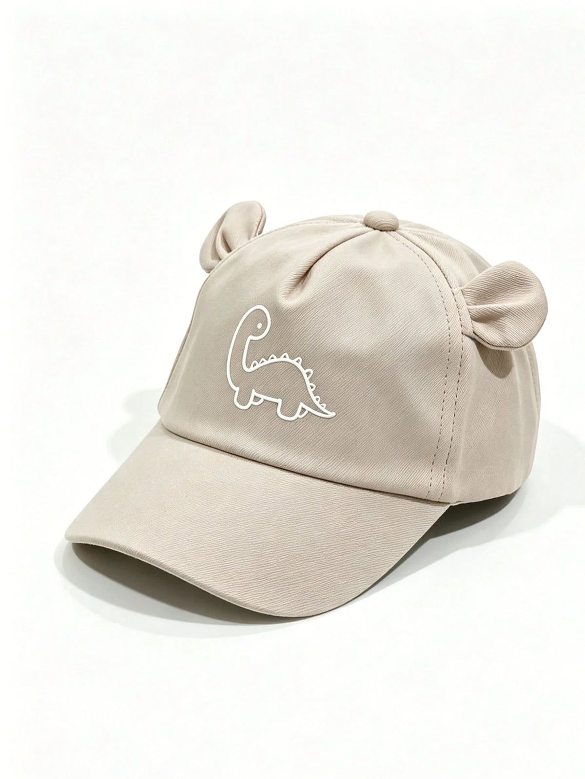 Prenda crema gorra para bebe con dinosaurio y orejitas vista frontal