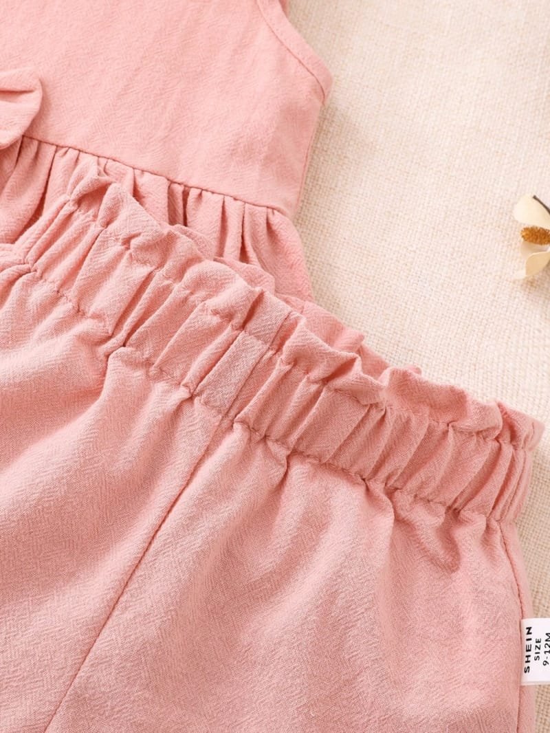 Conjunto rosa elegante con lazo para bebé niña