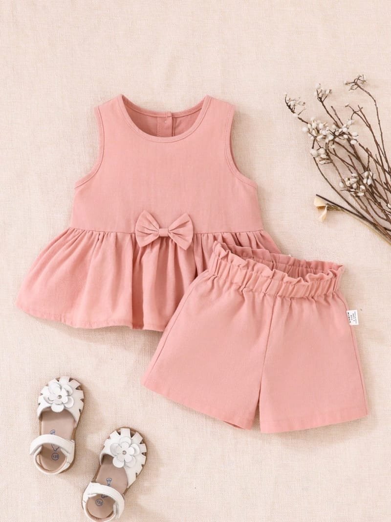 Conjunto rosa elegante con lazo para bebé niña