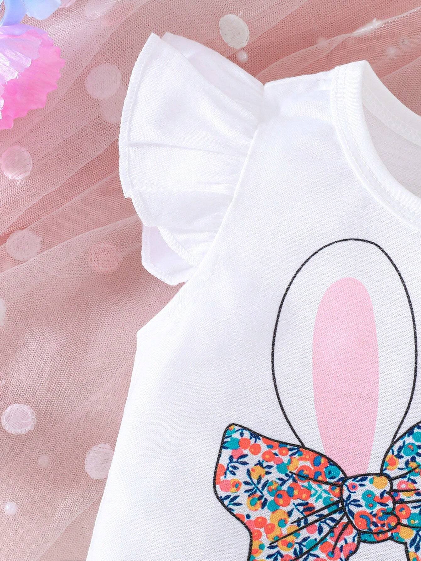 Conjunto blanco con conejo y pantalón floral multicolor