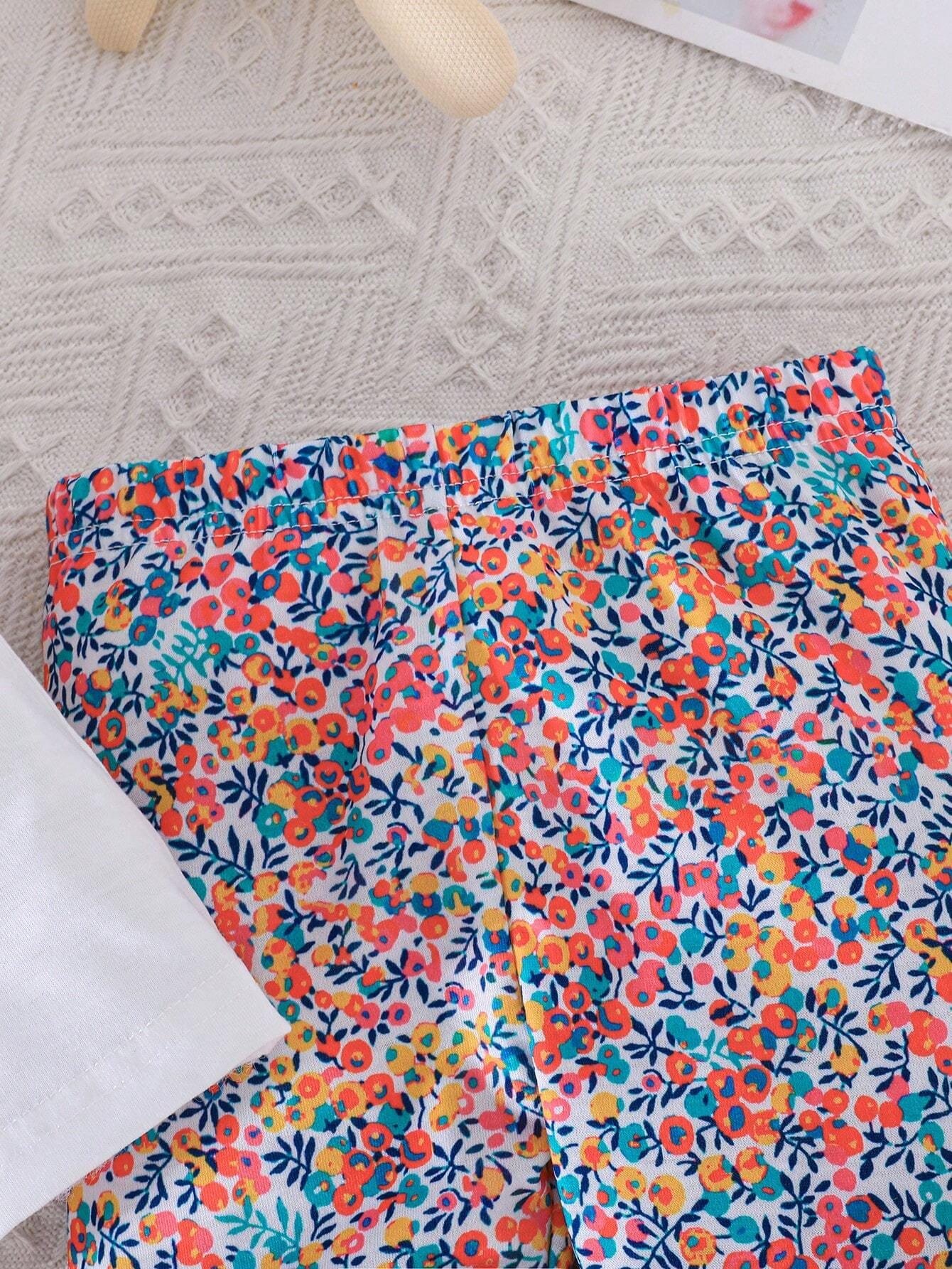 Conjunto blanco con conejo y pantalón floral multicolor