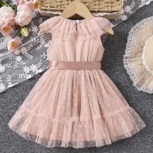 Vestido albaricoque con lunares y moño elegante bebé