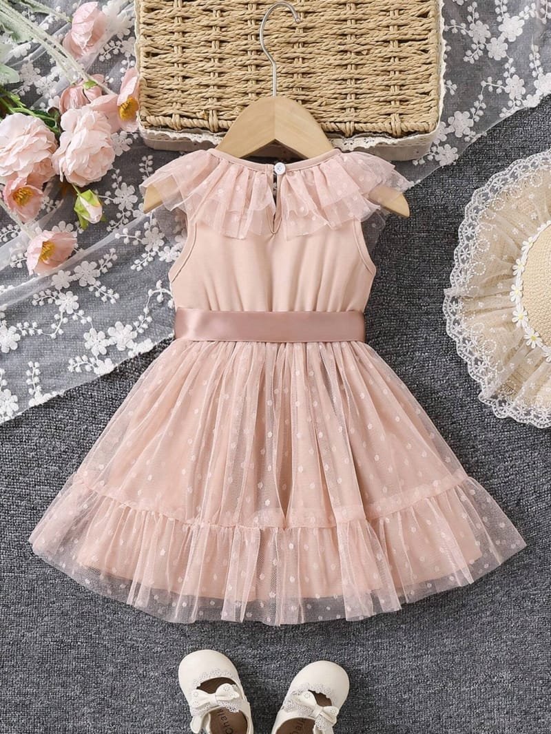 Vestido albaricoque con lunares y moño elegante bebé