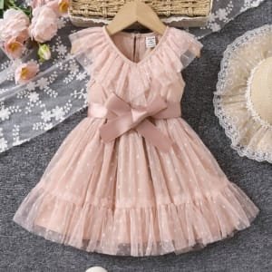 Vestido albaricoque con lunares y moño elegante bebé