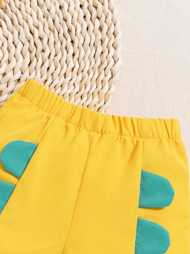 Conjunto amarillo con dinosaurio bebé niño divertido verano