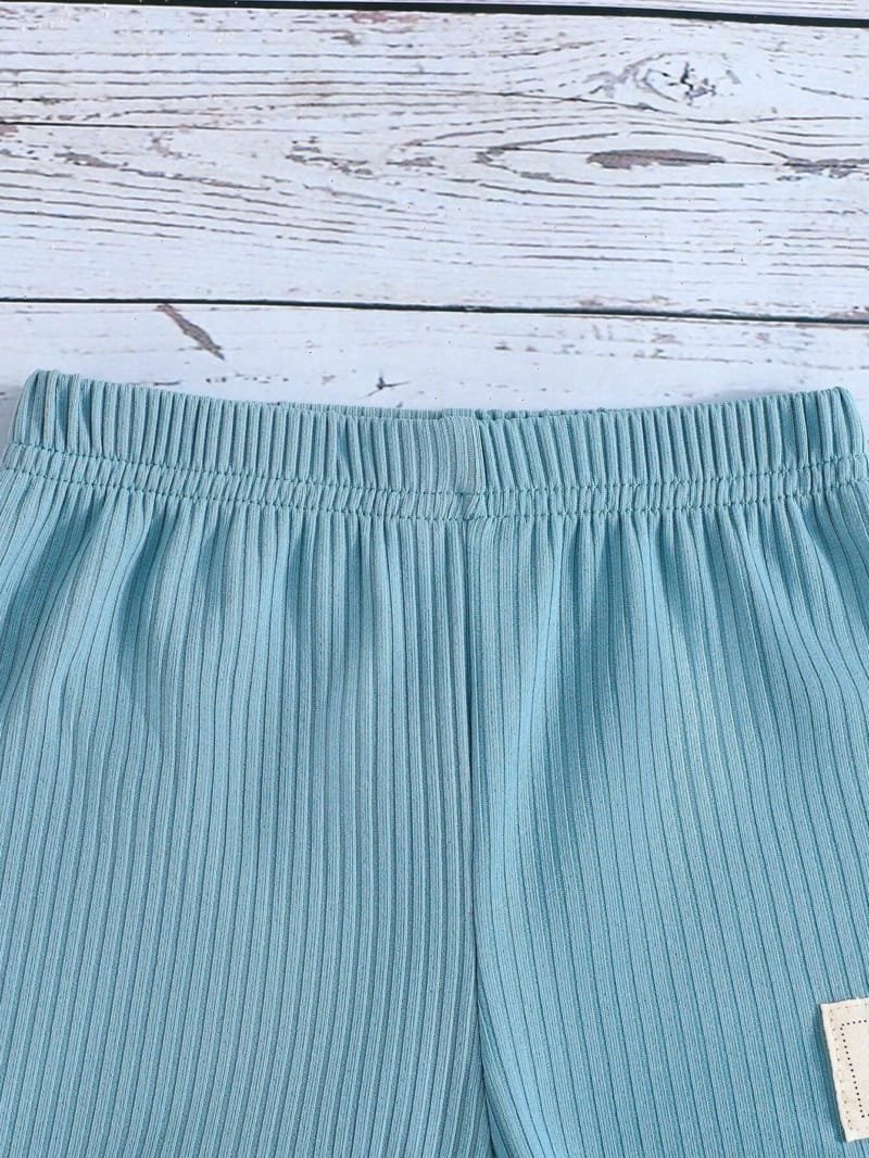Conjunto azul sin mangas con dinosaurios para bebé niño