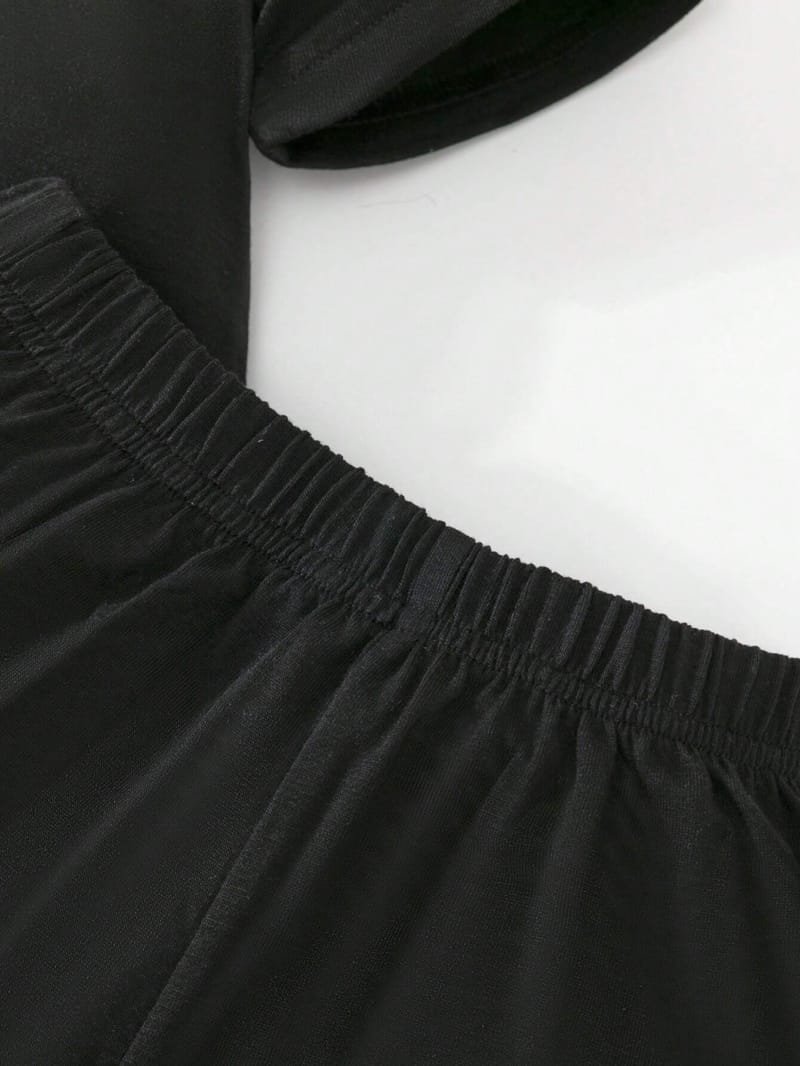 Conjunto negro con estampado de osito