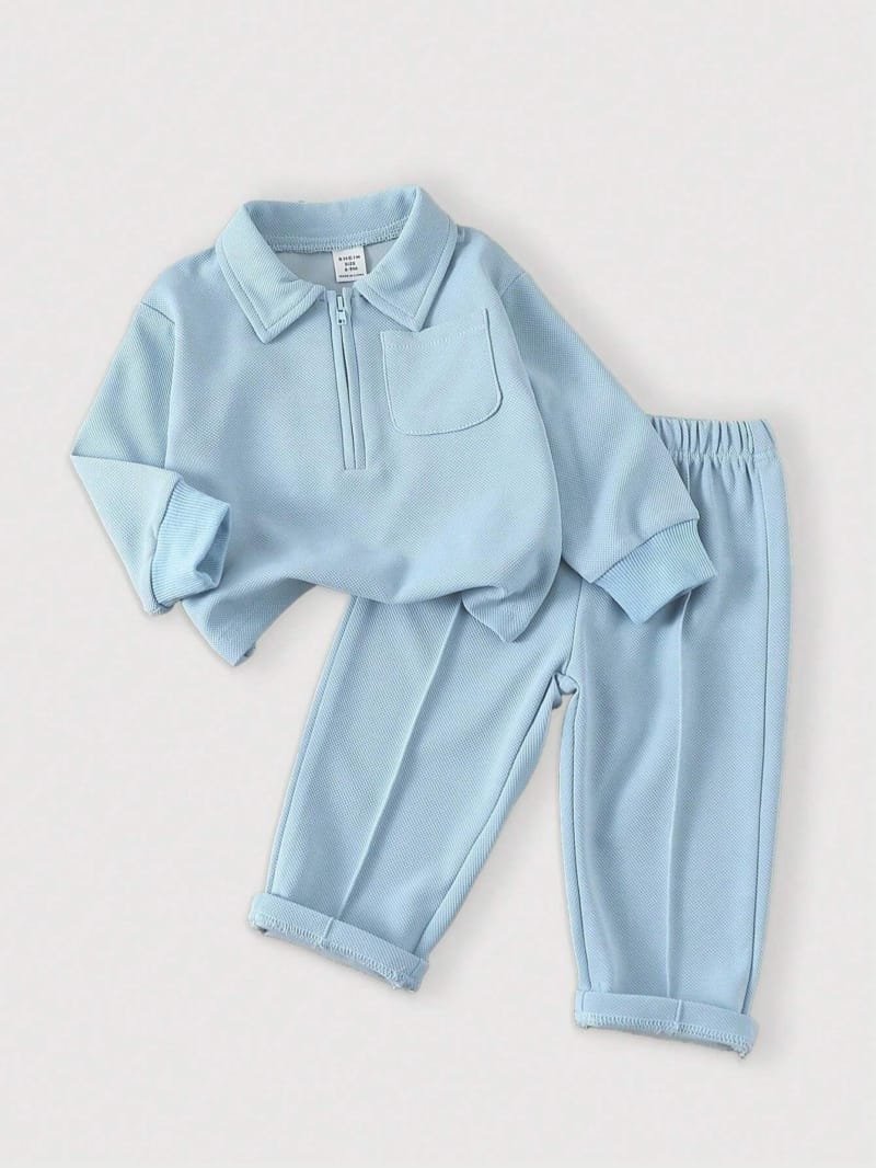 Conjunto azul bebé con cremallera y pantalón largo