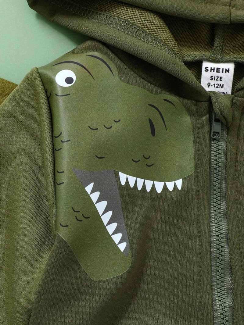 Chaqueta verde oscuro con capucha y dinosaurio divertido